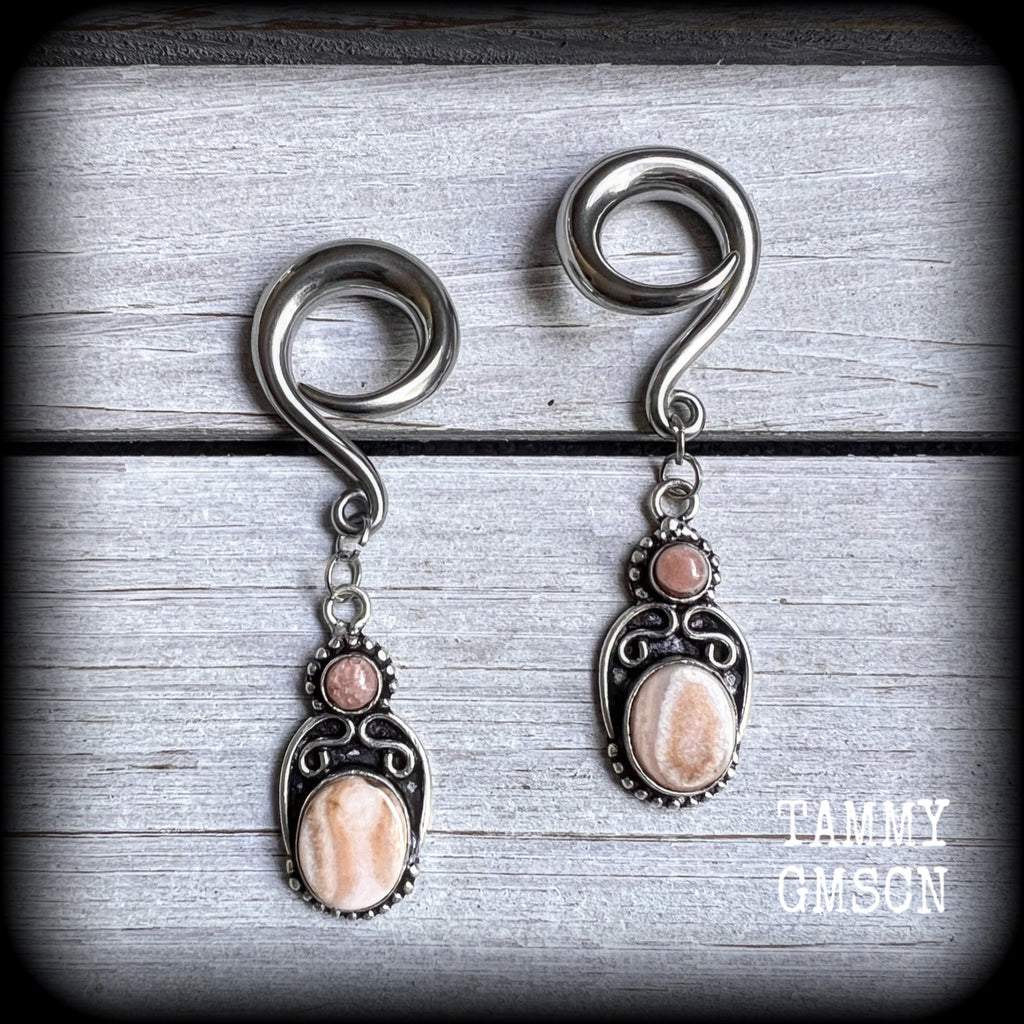 This pair of beautiful rhodochrosite gauged earrings features one smaller gemstone sitting atop a larger oval polished gemstone in a gorgeous boho antique silver setting. choose your own hooks from 6mm up to 30mm.