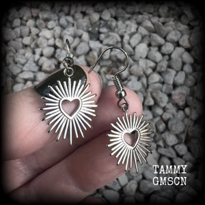 These adorable antique silver sacred heart earrings are nice and lightweight at only a gram or two a piece, and not too dangly, measuring just on 4cms from tip to tip.

This pair has been made on stainless steel french hooks to be worn through pierced ears.