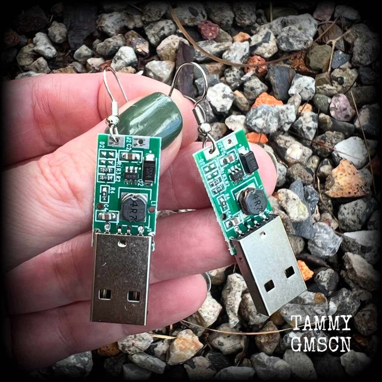 These awesome cyberpunk earrings feature a classic green USB, are nice and dangly, measuring just under 6cms from tip to tip, and nice and light weight, weighing only a few grams each.

This pair has been made on stainless steel french hooks, to be worn in pierced ears.