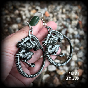 This pair of awesome earrings features large Alien Queen Xenomorphs, measuring 8.5cms from tip to tip (nice and big), and weigh 35 grams each (these are HEAVY).

This pair have been made with stainless steel french hooks-suitable for pierced ears.