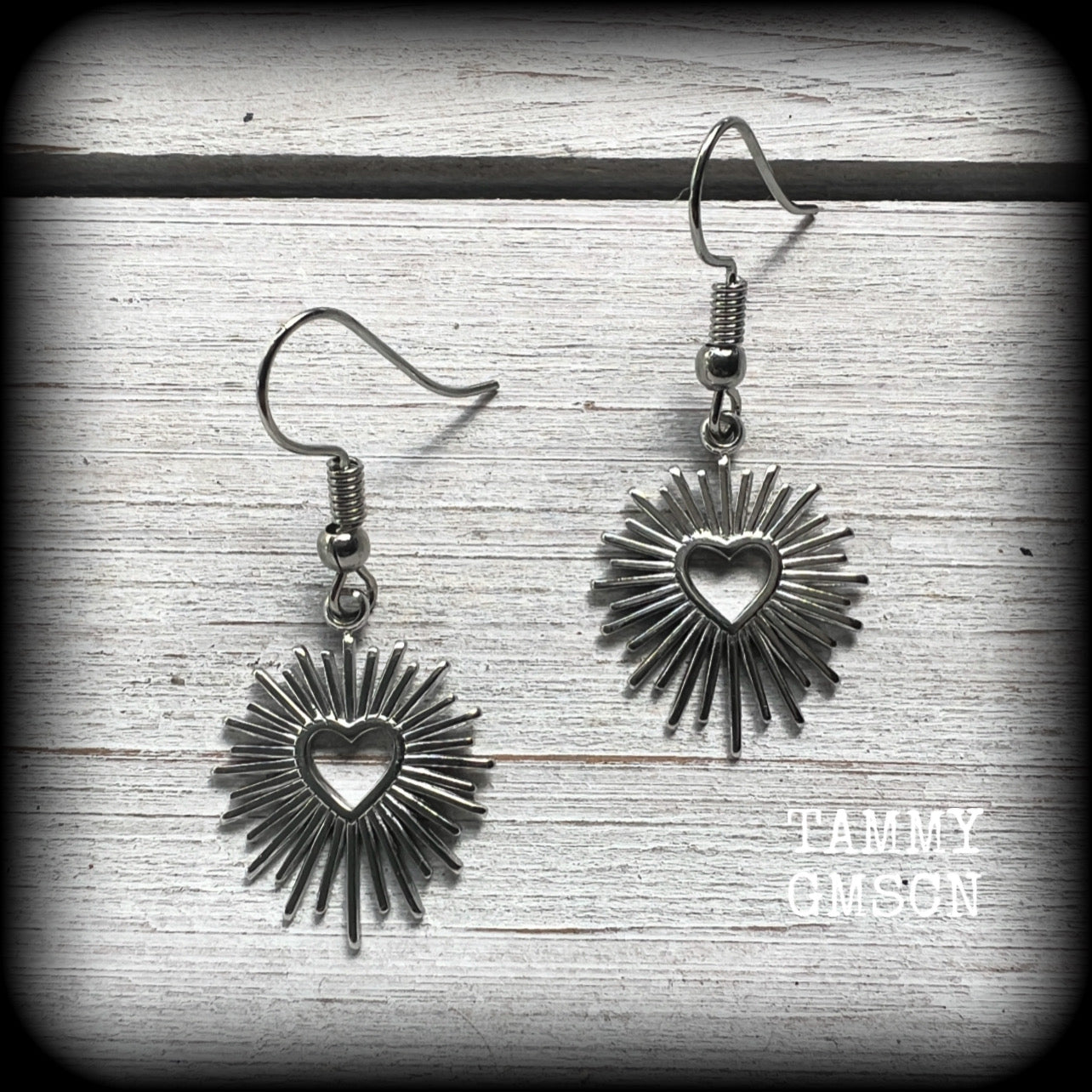 These adorable antique silver sacred heart earrings are nice and lightweight at only a gram or two a piece, and not too dangly, measuring just on 4cms from tip to tip.

This pair has been made on stainless steel french hooks to be worn through pierced ears.