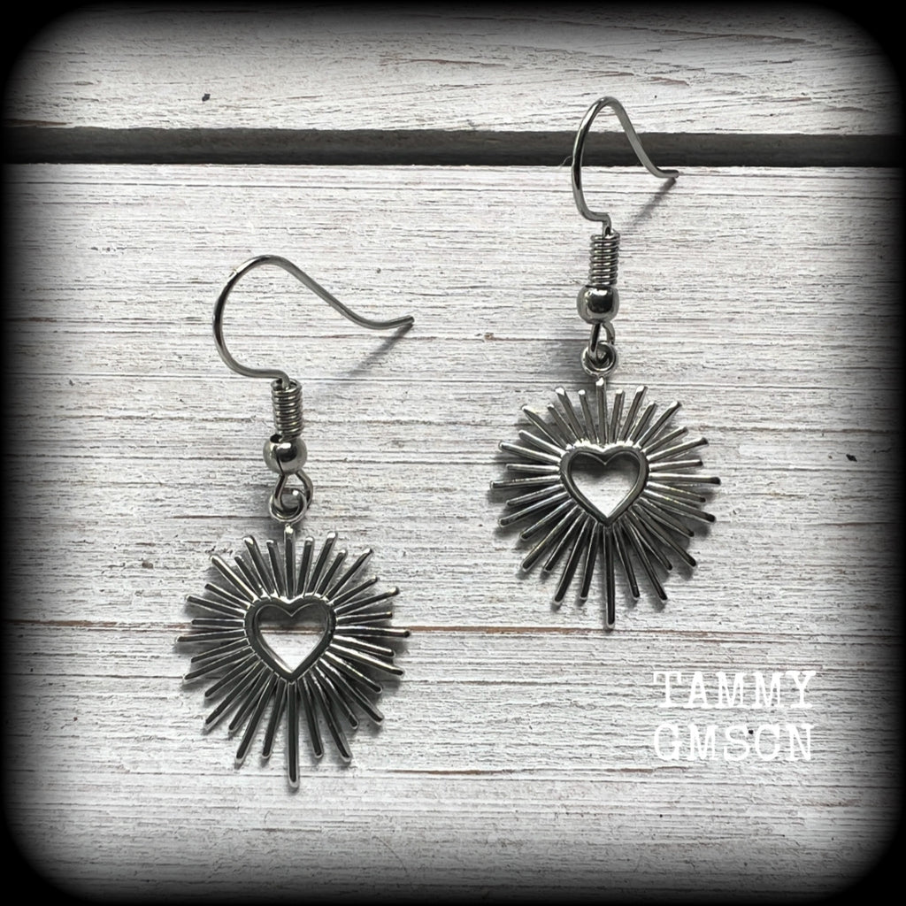 These adorable antique silver sacred heart earrings are nice and lightweight at only a gram or two a piece, and not too dangly, measuring just on 4cms from tip to tip.

This pair has been made on stainless steel french hooks to be worn through pierced ears.