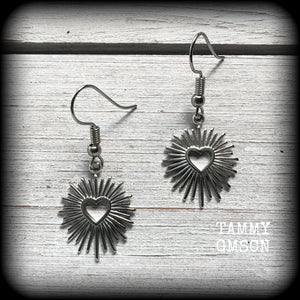 These adorable antique silver sacred heart earrings are nice and lightweight at only a gram or two a piece, and not too dangly, measuring just on 4cms from tip to tip.

This pair has been made on stainless steel french hooks to be worn through pierced ears.