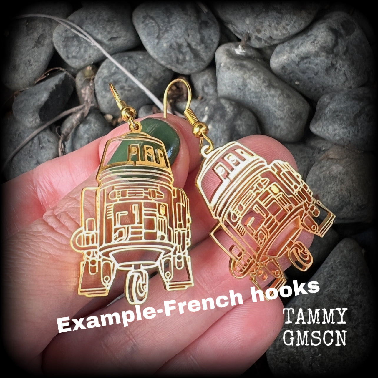 Featuring awesome stainless steel R2D2 charms, these earrings measure just over 5cms from tip to tip, and are super lightweight, weighing only a gram or two.
This pair has been made with french hooks, suitable for pierced ears.