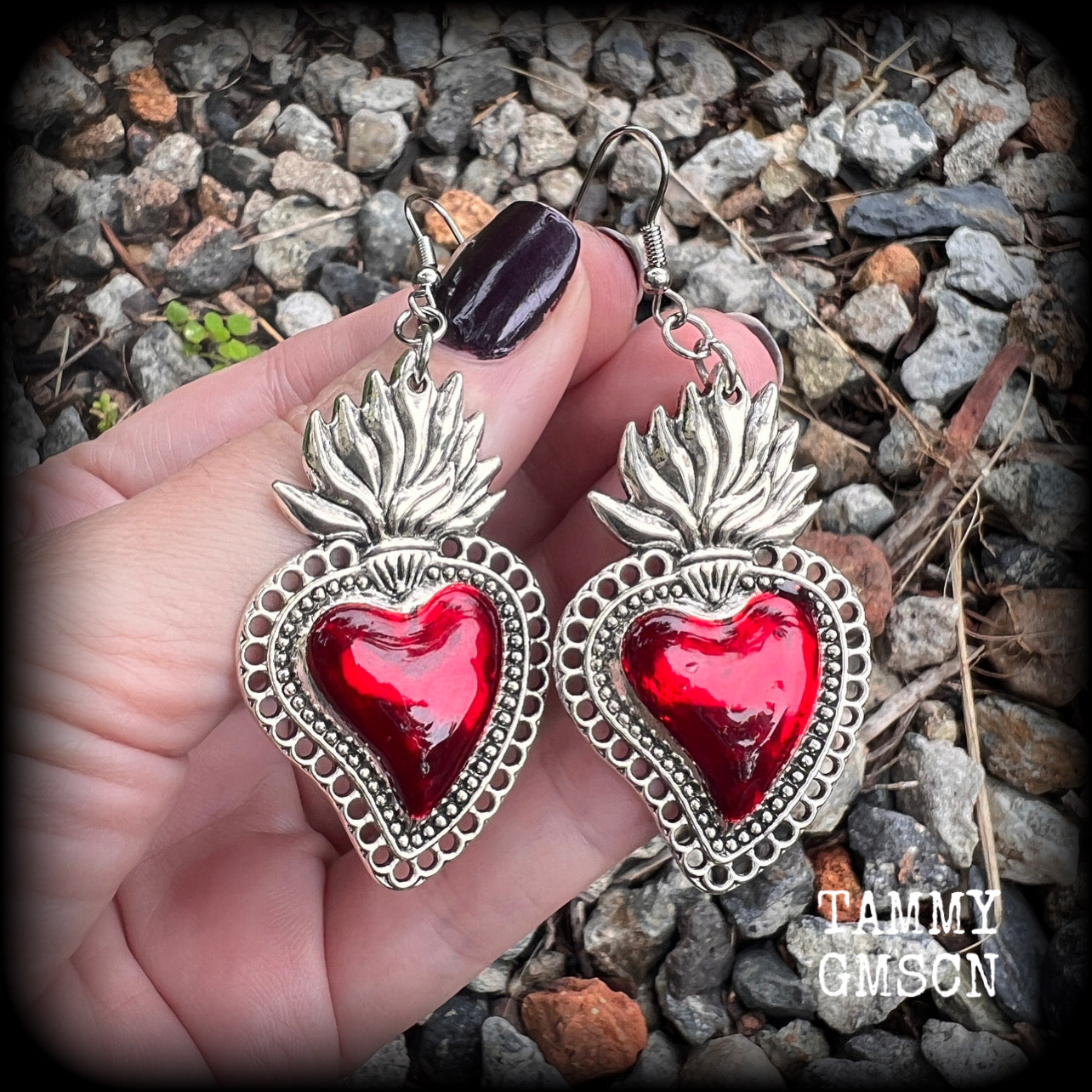 These beautiful red enamel and antique silver sacred heartearrings are nice and lightweight at approx 5 grams a piece, measuring just over 7cms from tip to tip.


This pair has been made on stainless steel french hooks to be worn through pierced ears.