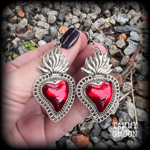 These beautiful red enamel and antique silver sacred heartearrings are nice and lightweight at approx 5 grams a piece, measuring just over 7cms from tip to tip.


This pair has been made on stainless steel french hooks to be worn through pierced ears.
