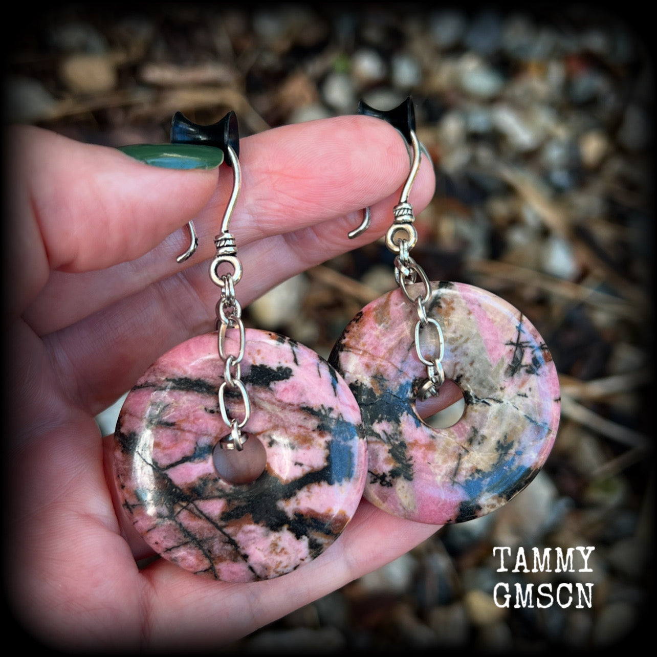 This is a pair of gorgeous ear hangers featuring dusty pink and chocolate brown Rhodonite gemstone donuts cradled in antique silver chain, weighing approx 23grams a piece, and measuring just under 7 cms from tip to tip.

This pair has made with small antique silver shephards hooks, to be worn with silicone earlets in stretched lobes from 8gauge (3mm).