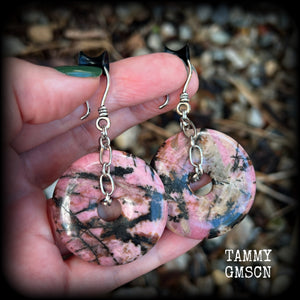 This is a pair of gorgeous ear hangers featuring dusty pink and chocolate brown Rhodonite gemstone donuts cradled in antique silver chain, weighing approx 23grams a piece, and measuring just under 7 cms from tip to tip.

This pair has made with small antique silver shephards hooks, to be worn with silicone earlets in stretched lobes from 8gauge (3mm).