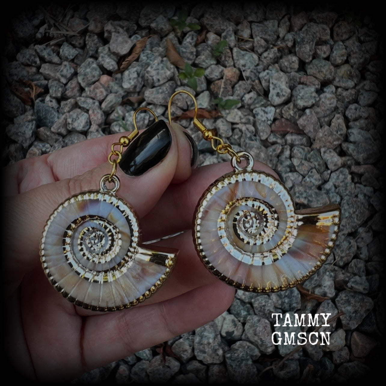 This pair of earrings feature gorgeous acrylic nautilus sea shells, super lightweight- weighing 6 grams each, measuring just approx 6cms from tip to tip. 

These beautiful earrings have been made with antique gold french hooks-for pierced ears.