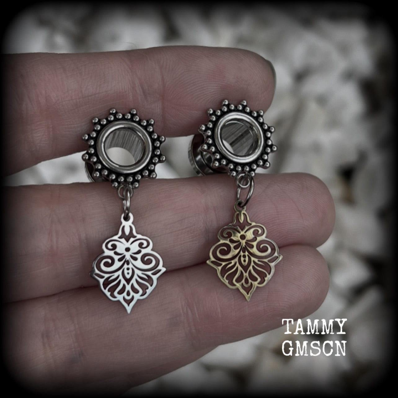 These beautiful ornate tunnel earrings feature gorgeous stainless steel filigree charms, inspired by Aphrodite, the Greek Goddess of love and beauty.

These earrings are nice and lightweight, weighing only a few grams each and measure just under 4cms from tip to tip.

This pair has been made with 0 gauge (8mm) gauge ornate surgical steel screw fit tunnels.