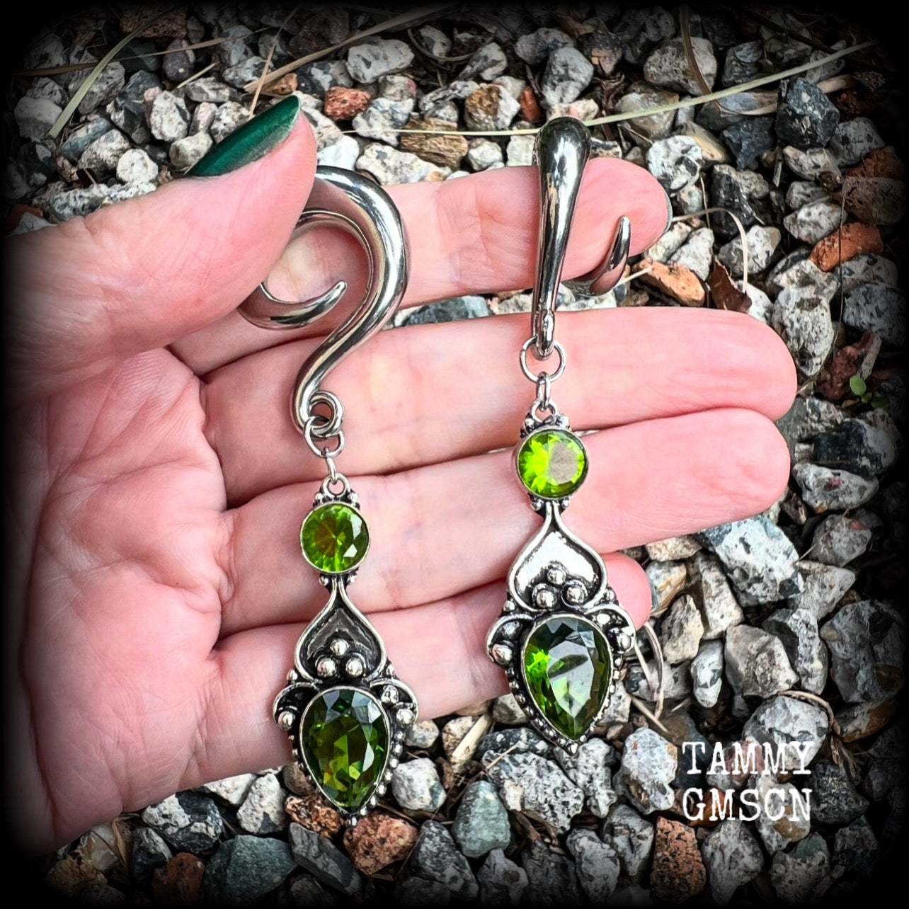 This pair of earrings features gorgeous green quartz and peridot gemstones in a boho antique silver setting, weighing approx 19 grams a piece and measuring just on 8.5cms from tip to tip.  This pair have been made on 0 gauge (8mm) surgical steel full curl hooks, to be worn in stretched lobes.