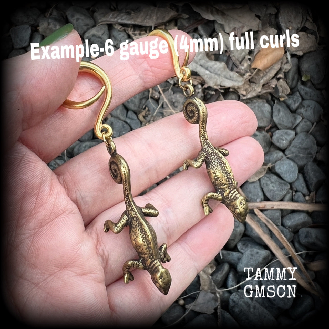 These awesome gauged earrings feature a pair of brass iguanas, are nice and dangly, measuring just on 7.5cms from tip to tip, and weighing approx 13 grams each.

This pair has been made on 6 gauge (4mm) surgical steel full curl hooks, to be worn in stretched lobes.

