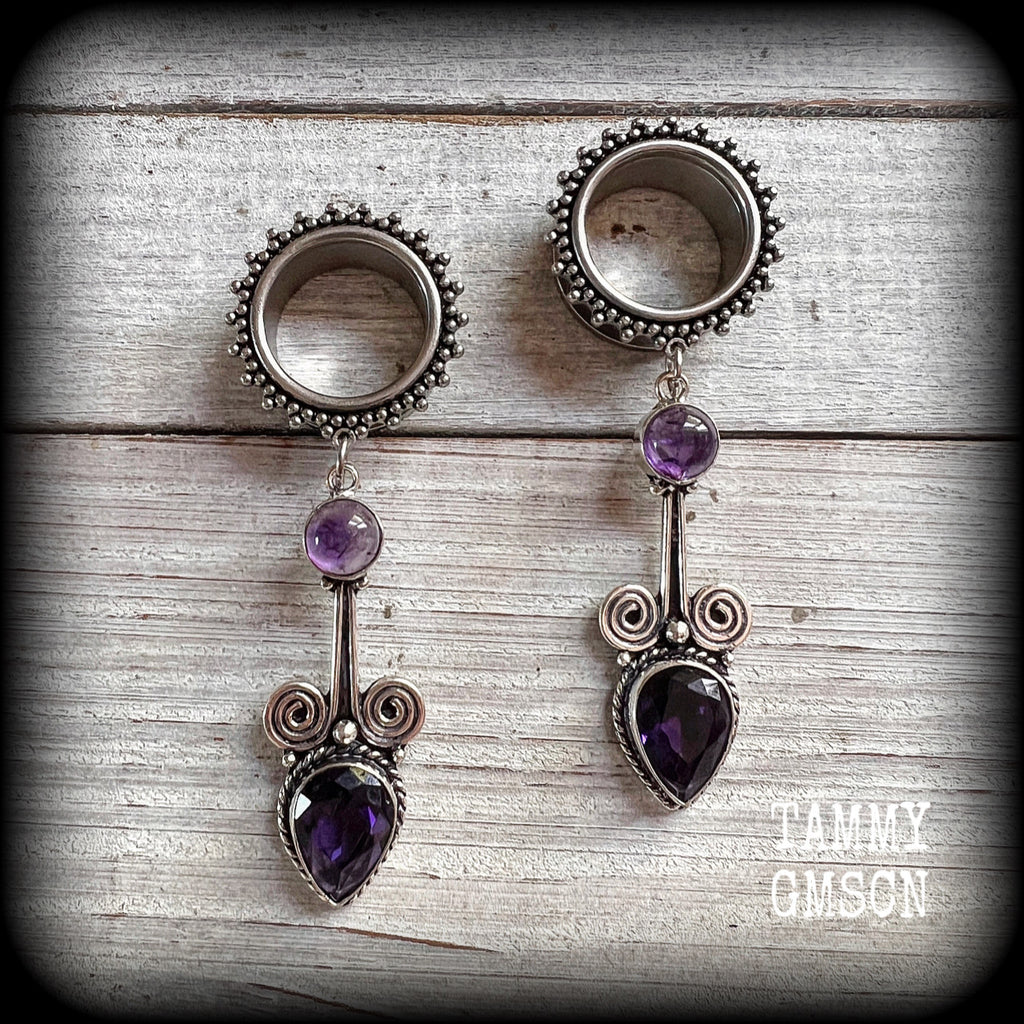 These gorgeous tunnel earrings have been made with beautiful polished and facet amethyst gemstones and antique silver boho settings.
These earrings are beautifully light weight, weighing approx 13 grams each and measure just under 8cms from tip to tip.

This pair have been made with 3/4" gauge (19mm) ornate surgical steel screw fit tunnels.