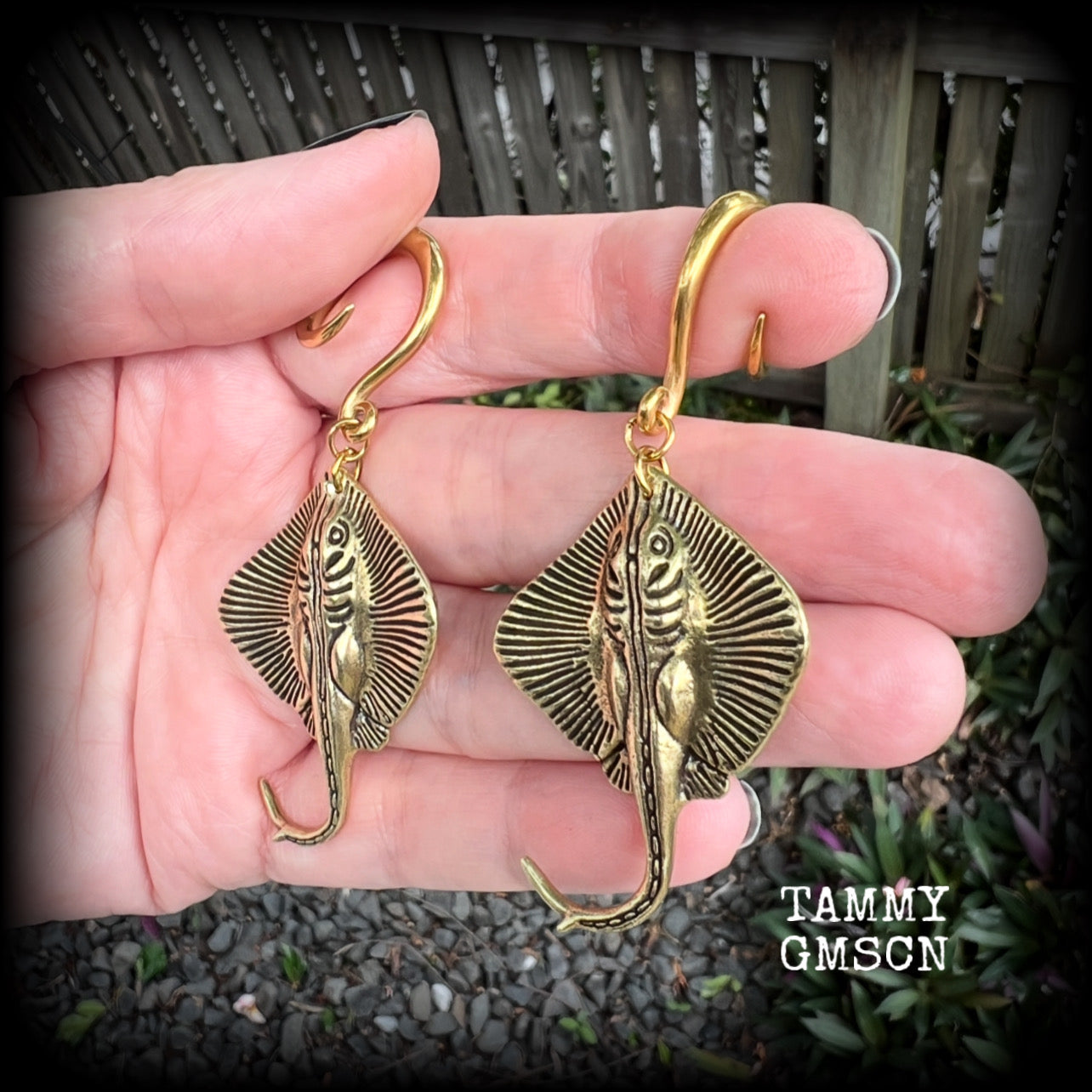 🔥 Symbolically, the stingray embodies calmness under pressure, self-defense, and navigating life's challenges with strength and balance.  

These awesome ear hangers feature a pair of brass sting rays, measuring just on 7cms from tip to tip, and weighing approx 17 grams each.

This pair has been made on 6 gauge (4mm) surgical steel full curls, suitable for stretched lobes.
