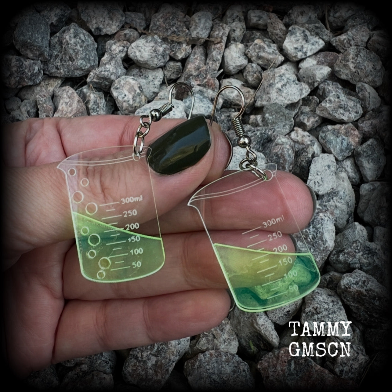 This pair of earrings features a pair of absolutely adorable classic Griffin chemistry beakers full of bubbly green liquid, measuring just under 6cms from tip to tip and weighing only a few grams each.

This pair have been made on stainless steel french hooks, suitable for pierced ears.