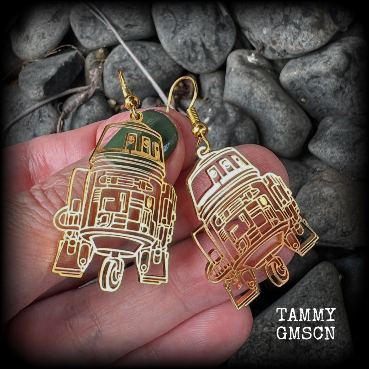 Featuring awesome stainless steel R2D2 charms, these earrings measure just over 5cms from tip to tip, and are super lightweight, weighing only a gram or two.
This pair has been made with french hooks, suitable for pierced ears.