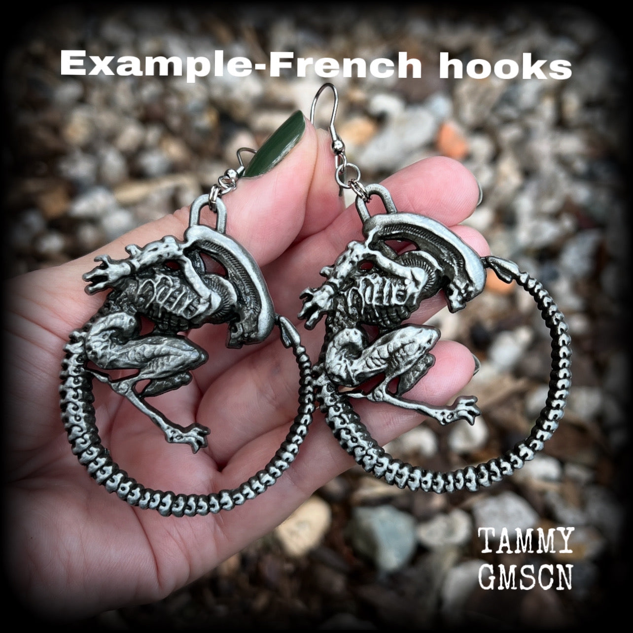 This pair of awesome earrings features large Alien Queen Xenomorphs, measuring 8.5cms from tip to tip (nice and big), and weigh 35 grams each (these are HEAVY).

This pair have been made with stainless steel french hooks-suitable for pierced ears.