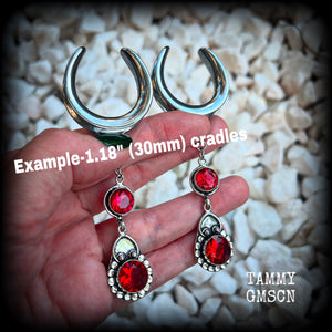 These beautiful boho Garnet ear hangers are made with gorgeous facet gemstones in a beautiful boho antique silver setting, measuring just on 10cm from tip to tip, and weighing 18 grams each, nice and lightweight. 

These earrings have been made on 1.18" gauge (30mm) surgical steel cradles, to be worn in stretched lobes.
