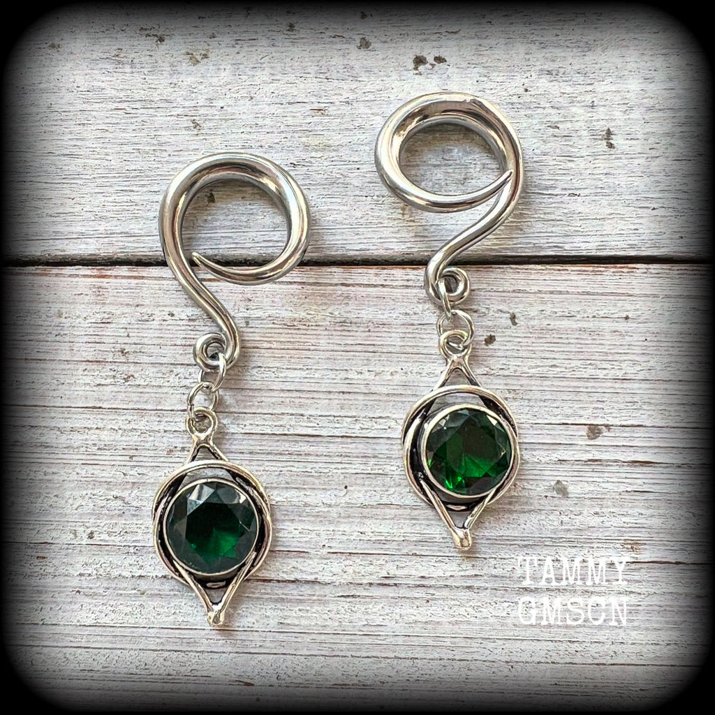 This pair of earrings features gorgeous green quartz gemstones in a beautiful antique silver setting knotwork setting, weighing approx 5 grams a piece and measuring just on 5.5cms from tip to tip.

This pair have been made on 6 gauge (4mm) surgical steel full curl hooks, to be worn in stretched lobes.
