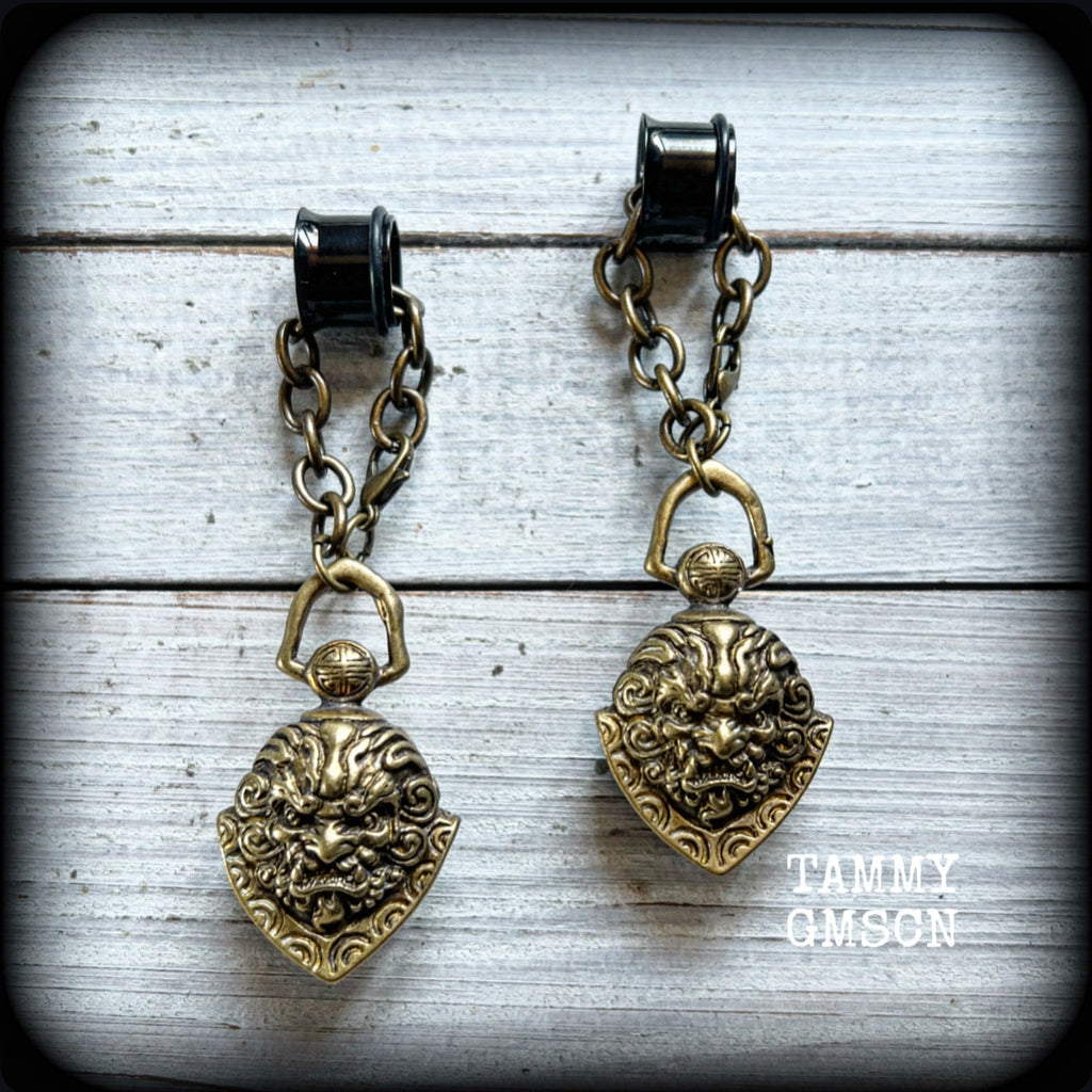 These unique tunnel dangles feature brass lion guardian bells, used in Tibetan Buddhism,  weighing approx 20 grams each, and measuring 8.5cms from tip to tip.  ✨ The ball inside the bell that rings has been disabled so these earrings wont make noise as you go about your day.