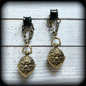These unique tunnel dangles feature brass lion guardian bells, used in Tibetan Buddhism,  weighing approx 20 grams each, and measuring 8.5cms from tip to tip.  ✨ The ball inside the bell that rings has been disabled so these earrings wont make noise as you go about your day.