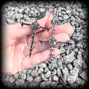 These gorgeous gothic earrings feature gunmetal grey skeleton crosses, measuring just over 8 cms from tip to tip, and weigh approx 7 grams a piece.

This pair have been made on stainless steel french hooks, suitable for pierced ears.