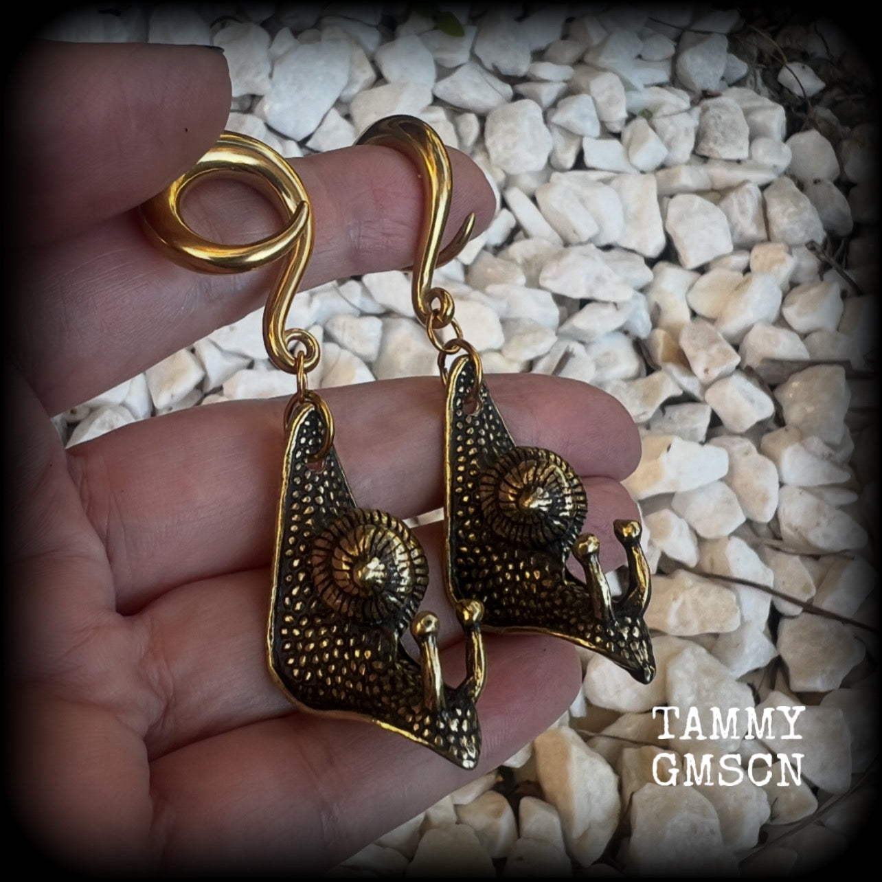 These awesome brass snail ear hangers feature gorgeous brass garden snails, measuring just on 7.5cms from tip to tip, and weighing approx 30 grams each.

This pair has been made on 2 gauge (6mm) surgical steel full curls, suitable for stretched lobes.