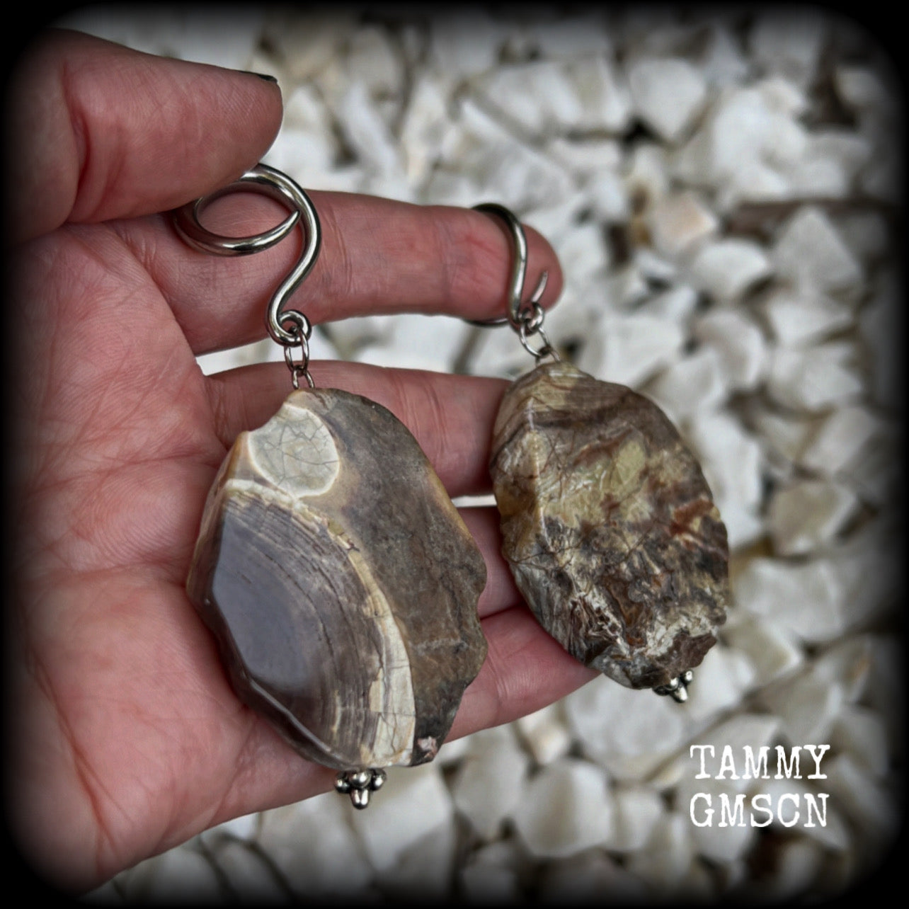 This pair of gorgeous gauged earrings features unique petrified wood slices, weighing in at approx 23 grams a piece, and are nice and dangly at just on 8cms from tip to tip.

This pair has been made on 6 gauge (4mm) surgical steel full curl hooks, to be worn in stretched lobes.
