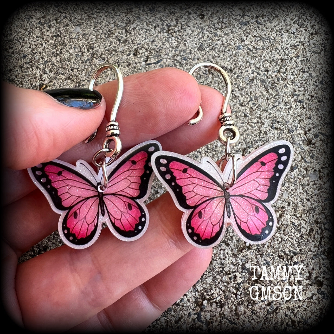 This is a pair of beautiful pink butterfly earrings, available on a selection of hooks and clasps for pierced ears and stretched lobes.