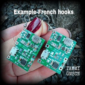 These awesome cyberpunk circuit board earrings measure just under 6 cms from tip to tip, and weigh only a few grams each, these are lovely and lightweight and not too dangly.

This pair has been made on stainless steel french hooks, to be worn in pierced ears.
