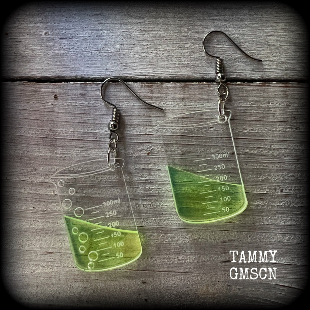 This pair of earrings features a pair of absolutely adorable classic Griffin chemistry beakers full of bubbly green liquid, measuring just under 6cms from tip to tip and weighing only a few grams each.

This pair have been made on stainless steel french hooks, suitable for pierced ears.