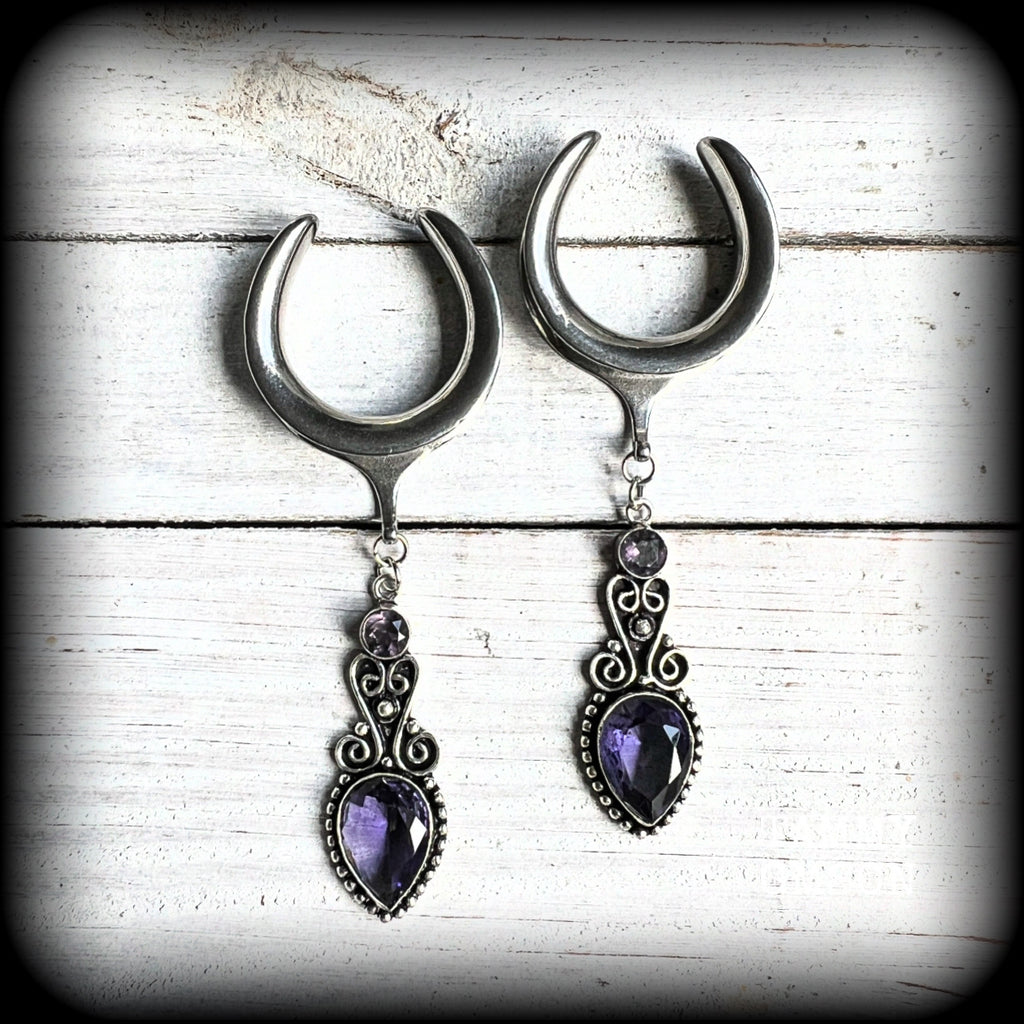These gorgeous gauged earrings feature beautiful purple facet amethyst gemstones in an antique silver boho setting, measuring just over 9.5 from tip to tip, and weighing approx 17 grams a piece.

This pair have been made on 1.18” gauge (30mm) surgical steel cradles-suitable for stretched lobes.