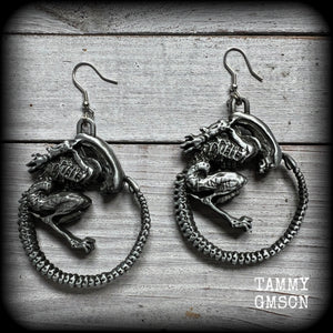 This pair of awesome earrings features large Alien Queen Xenomorphs, measuring 8.5cms from tip to tip (nice and big), and weigh 35 grams each (these are HEAVY).

This pair have been made with stainless steel french hooks-suitable for pierced ears.