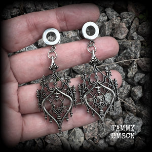 These gorgeous gothic tunnel earrings feature a beautiful antique silver ornate gothic cathedral architectural arch, measuring just on 7cms from tip to tip, and weighing approx 10 grams each.

This pair has been made on 0 gauge (8mm) surgical steel screw fit tunnels.
