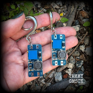These awesome earrings feature pieces of blue circuitry, are nice and dangly, measuring just on 7cms from tip to tip, and nice and light weight, weighing approx 12 grams each.

This pair has been made on 2 gauge (6mm) surgical steel full curl hooks, to be worn in stretched lobes.