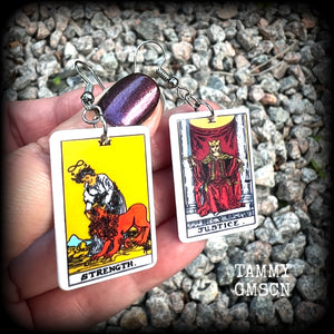 These classic Major Arcana earrings feature lightweight acrylic 'Strength' and ‘Justice’ tarot card charms, measuring just under 6cms from tip to tip, and weighing only a few grams each.

This pair has been made with stainless steel french hooks, suitable for pierced ears.