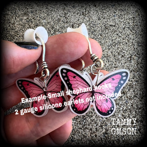 This is a pair of beautiful pink butterfly earrings, available on a selection of hooks and clasps for pierced ears and stretched lobes.