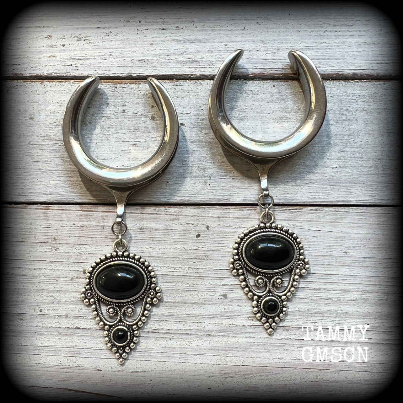 These beautiful ear hangers have been made with gorgeous pitch black obsidian gemstones in an antique silver boho setting, lovely and dangly at 8.5cm from tip to tip, and weighing approx 15 grams each.

These earrings have been made on 1.18” gauge (30mm) surgical steel cradles, to be worn in stretched lobes.