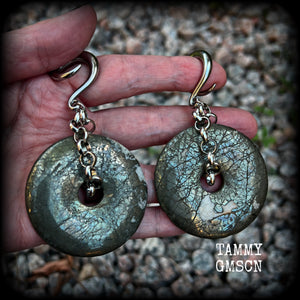 These beautiful big gauged earrings feature gorgeous Pyrite donut gemstones cradles in chunky antique silver chain, measuring just over 9cms from tip to tip, and weighing approx 55 grams each.

This pair has been made on 2 gauge (6mm) surgical steel full curls, to be worn in stretched lobes.