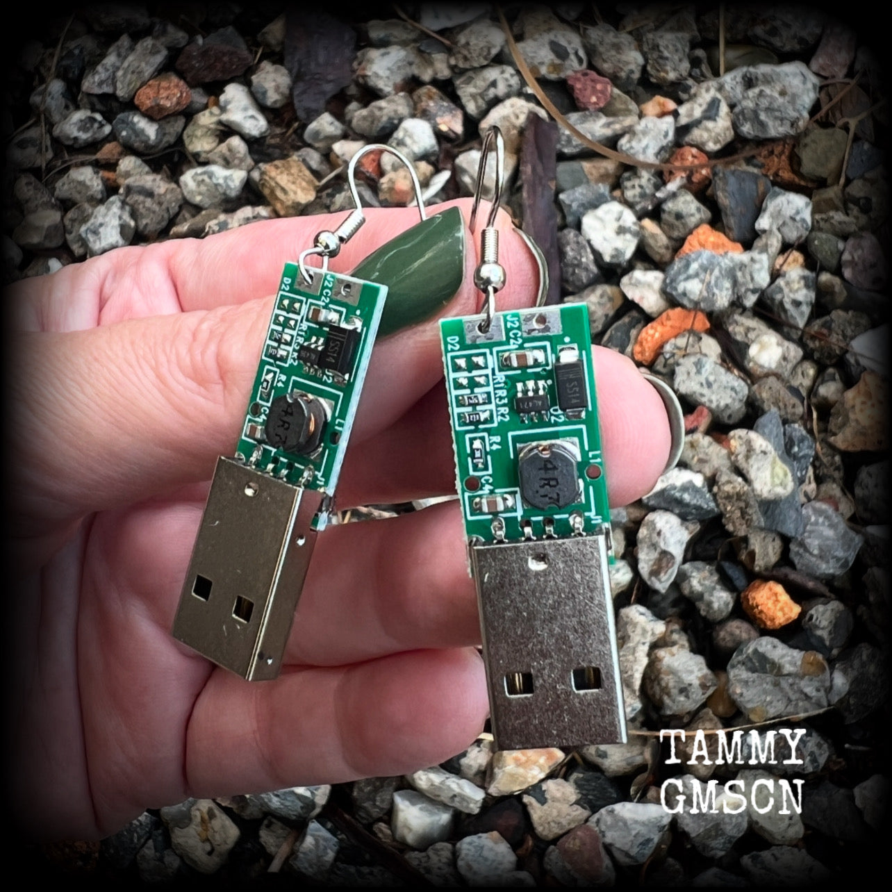 These awesome cyberpunk earrings feature a classic green USB, are nice and dangly, measuring just under 6cms from tip to tip, and nice and light weight, weighing only a few grams each.

This pair has been made on stainless steel french hooks, to be worn in pierced ears.