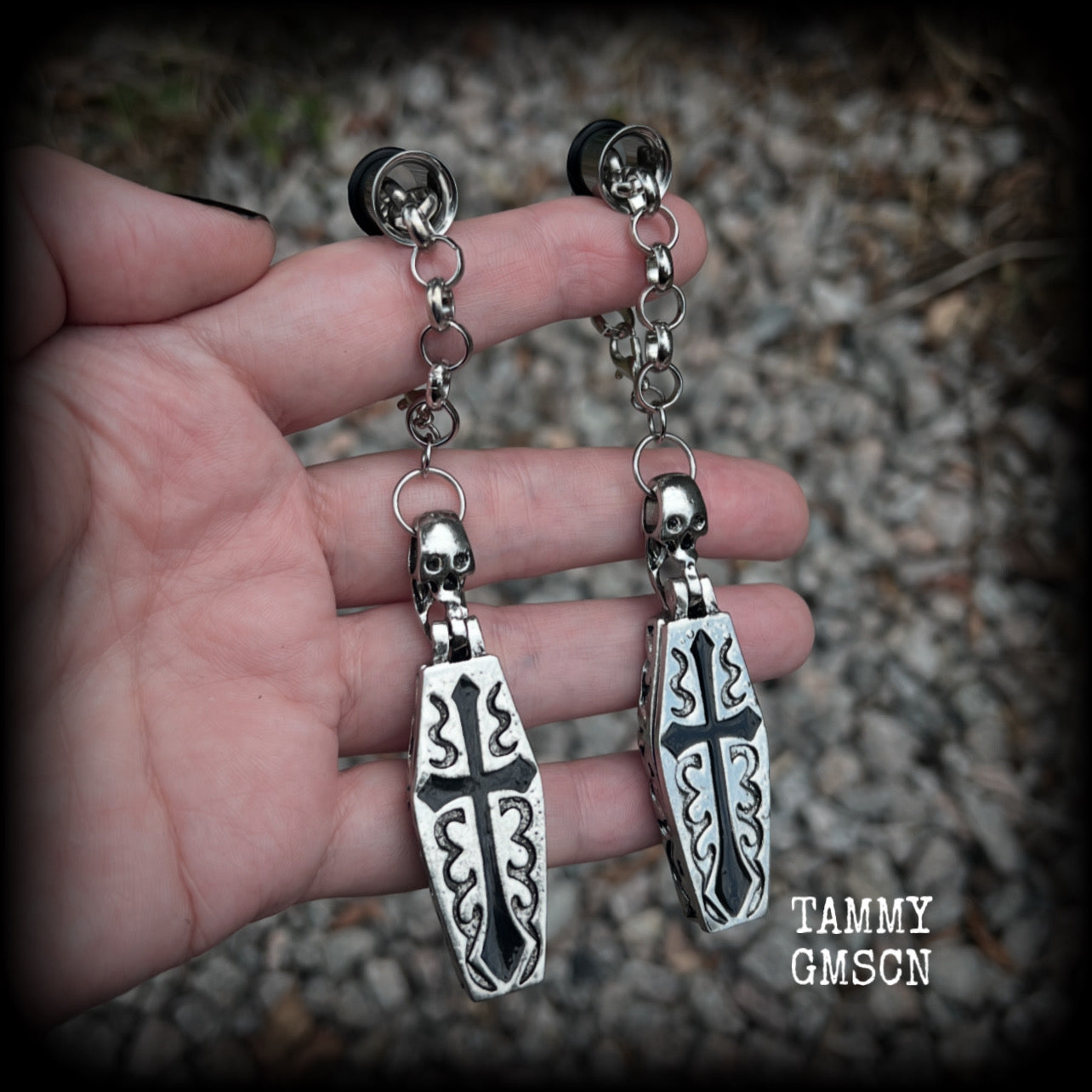 These beautiful antique silver and black enamel coffin tunnel dangles are nice and dangly, weighing approx 25 grams each, and measuring just over 11cms from tip to tip.

⚰️ This listing is for a chunky chain/lobster clasp combination suitable for 00 gauge and larger. 
If you choose a smaller size of tunnel than 00 gauge we will make these on a smaller chain.