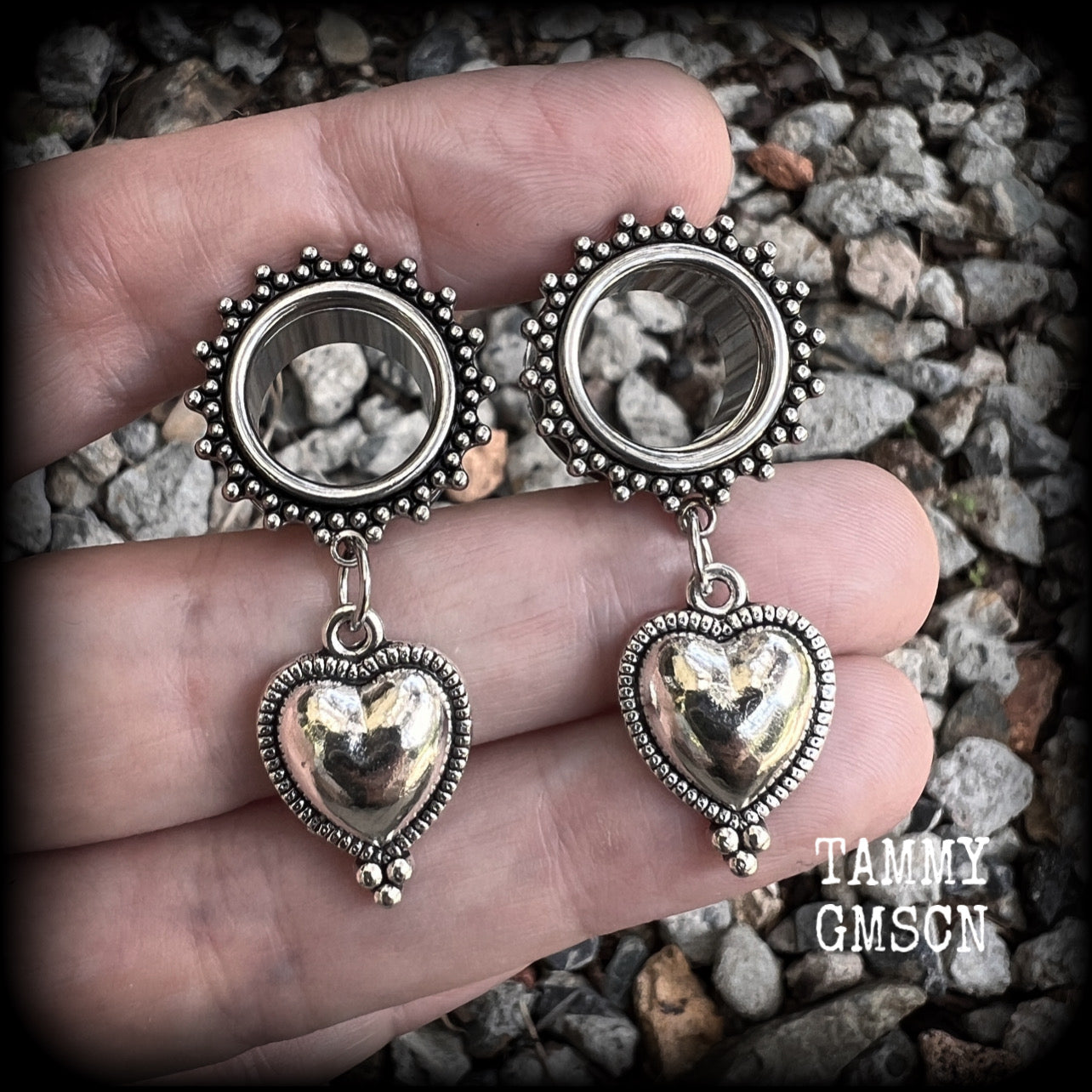 These gorgeous tunnel earrings feature beautiful antique silver hearts, are nice and lightweight, weighing only 7 grams each and measure approx 4.5cms from tip to tip.
This pair has been made with 9/16" (14mm) gauge ornate surgical steel screw fit tunnels.