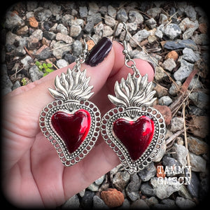 These beautiful red enamel and antique silver sacred heartearrings are nice and lightweight at approx 5 grams a piece, measuring just over 7cms from tip to tip.


This pair has been made on stainless steel french hooks to be worn through pierced ears.