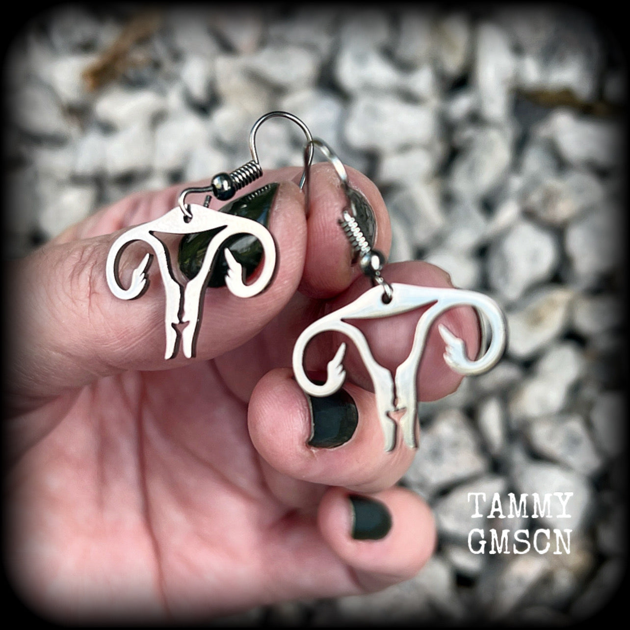 These amazing earrings feature offensive stainless steel female reproductive organs giving the middle finger! Nice and lightweight, weighing only a few grams each, these earrings measure approx 3.5cms from tip to tip.

This pair have been made on stainless steel french hooks, for pierced ears.