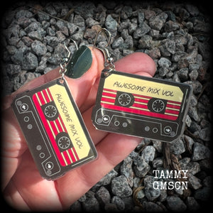 This awesome pair of earrings features a pair of classic 80’s mix tapes, are nice and lightweight weighing only a few grams each, and measure approx 7cms from tip to tip.

This pair has been made on stainless steel french hooks, suitable for pierced ears.