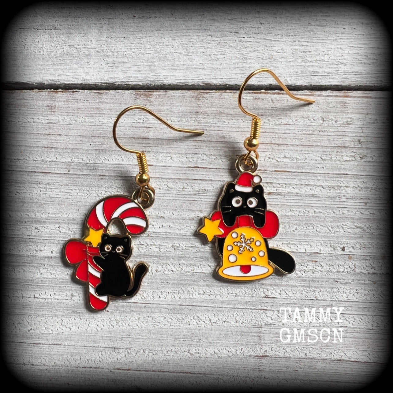 These adorable earrings feature mischievous black cats with Christmas decorations, measuring approx 3.5cms from tip to tip and weighing only a few grams each. 

This pair has been made on antique gold french hooks, for pierced ears.
