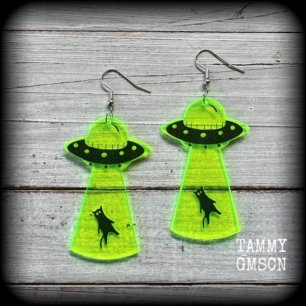 These super cute fluoro green and black earrings show an unsuspecting black cat being beamed up into a UFO!! 
Measuring 8cms from tip to tip, and weighing only 2 grams each (nice and light weight), this pair has been made on stainless steel french hooks, suitable for pierced ears.