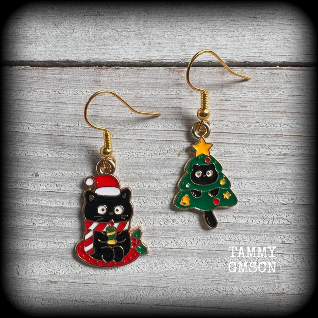 These adorable earrings feature mischievous festive black cats, measuring approx 3.5cms from tip to tip and weighing only a few grams each. 

This pair has been made on antique gold french hooks, for pierced ears.