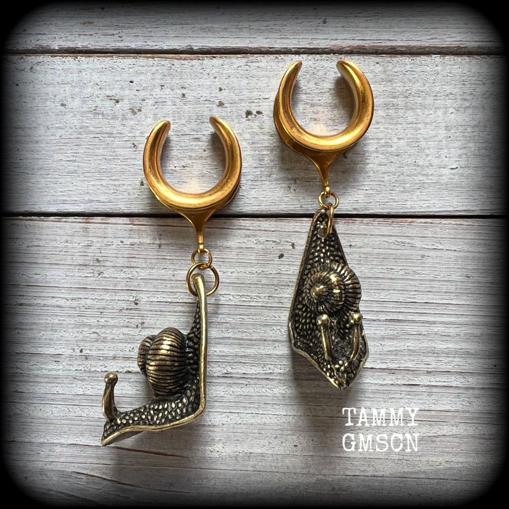 These awesome brass snail ear hangers feature gorgeous brass garden snails, measuring just on 7.5cms from tip to tip, and weighing approx 27 grams each.

This pair has been made on 3/4” gauge (19mm) surgical steel cradles, suitable for stretched lobes.