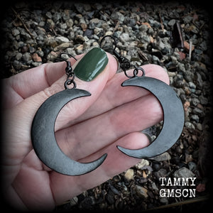 Featuring large black enamel crescent moons, these stunning crescent moon earrings measure just under 7cms from tip to tip and are nice and light weight at approx 5 grams each.

This pair has been made with french hooks, for pierced ears.
